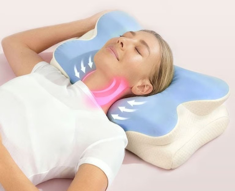 Contoured pillow shown supporting the head and neck